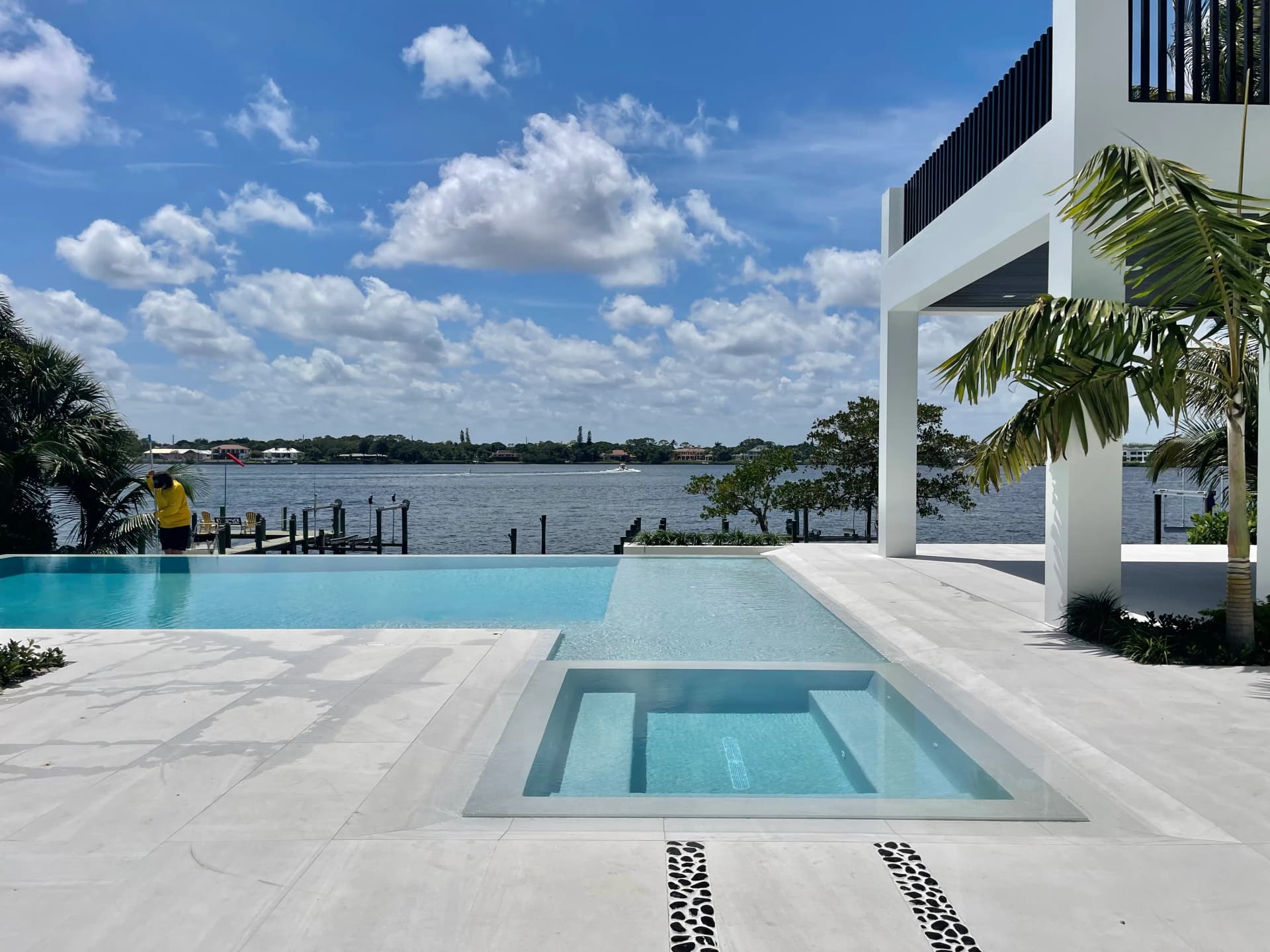 Infinity pool and spa with dock and Loxahatchee River views